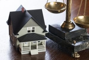 Real estate law is the set of laws that determine who can own or use land